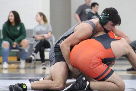 Senior JT Stambeck on his way to pinning his opponent.