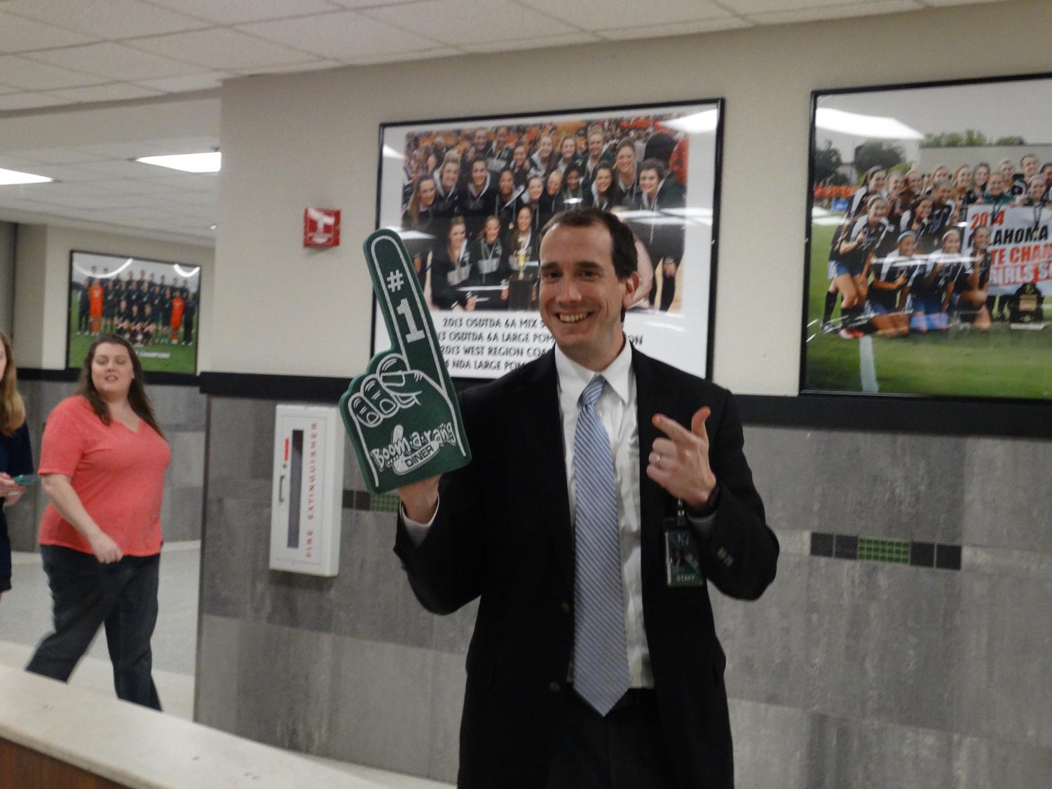 Mr. Liesenfeld stops to pose while directing parents around the school