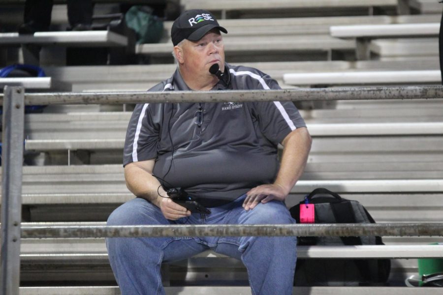 Mr. Davis watches over the halftime performance of the Marching Band.