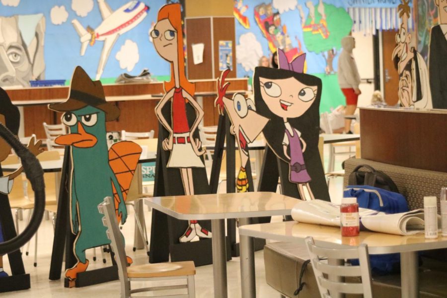 Wooden cut-outs of the Phienas & Ferb theme.