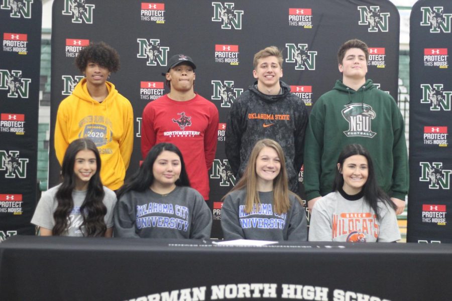 The eight athletes who signed their Letters of Intent.
