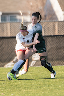 Annabella Potts, senior, showing what it means to get stuck in to a tackle.