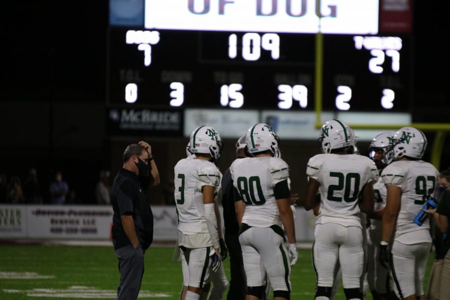 The team gathers during a timeout in the second quarter.