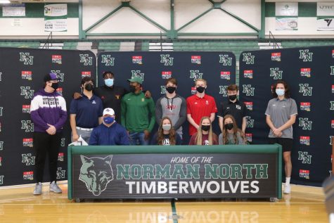The athletes line up for a picture after signing day. 