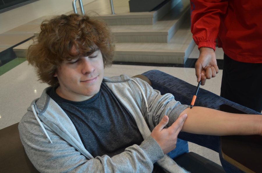 Student giving blood.