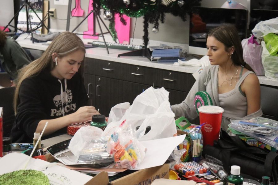 Aniston Tiller and Courtney Ridham make decoration for Photography Clubs Spooktacular room. 