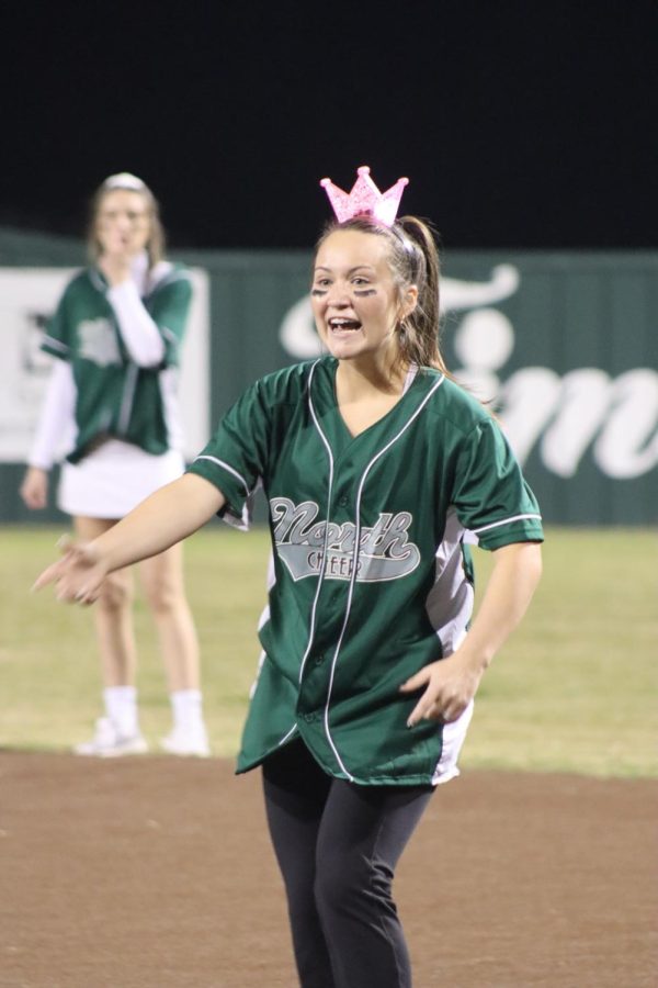 Rachel Tipton (senior), a member of the Kickball Kweens, cheers on her teammates. 