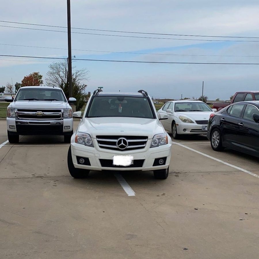 A car parked in two spaces, as shown on @nnhs_badparking. 