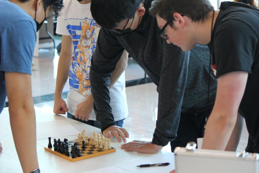 Andy Wang plays a game of chess at the Club Fair. 