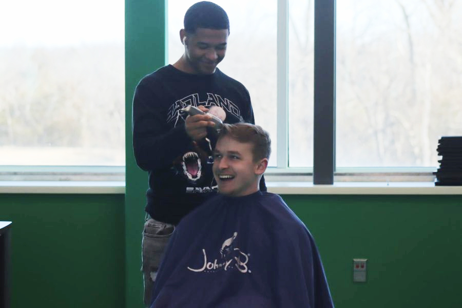 Jared Pratio cutting Aiden Niess hair. 