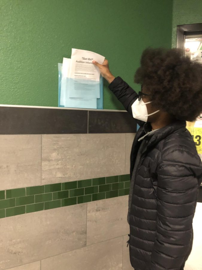 A student reaches for a Lost Girl audition packet. 
