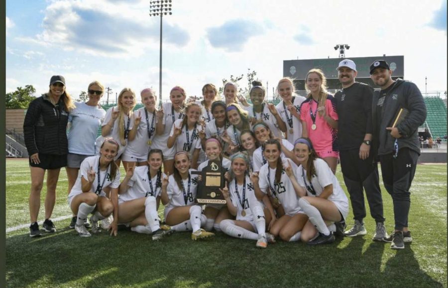 Trevor Lafoon (far left) with the Norman North Girls Soccer Team after they won ^A 
State Championship. 