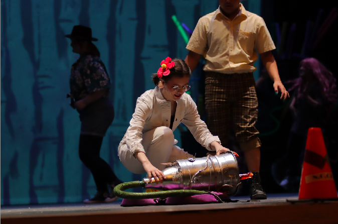 Katrina Gedmin moves a prop during the Spongebob: The Musical dress rehearsal. 