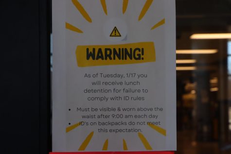 A notice displayed on the commons entrance showing the new ID policy