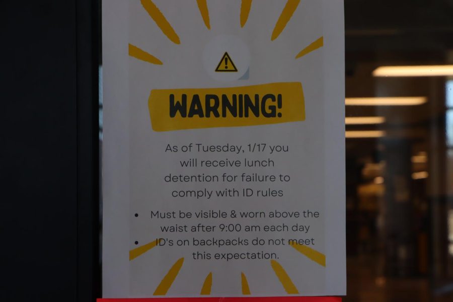 A notice displayed on the commons entrance showing the new ID policy