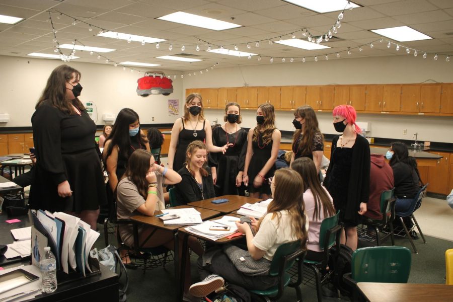 Last years choir students perform a Val-O-Gram in a science classroom.