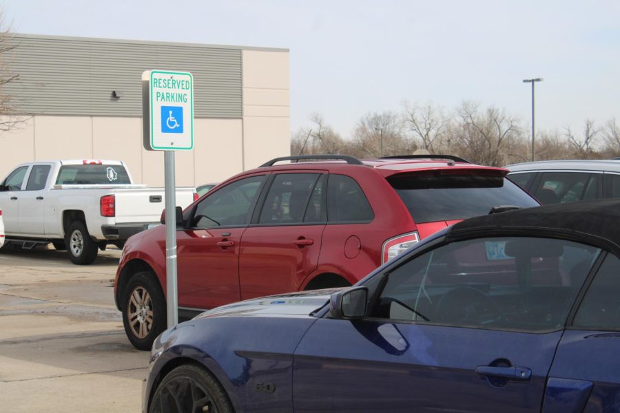 Cars parked in the Norman North Parking Lots handicapped spots