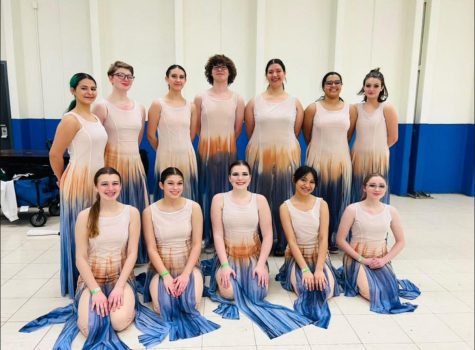 Photo of everyone in Winter guard smiling for a photo