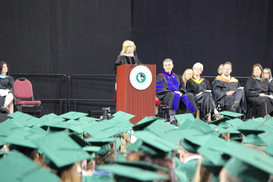 Students+listen+to+the+principal+Dr.+Garrett+give+a+speech+at+the+Class+of+2022+graduation.